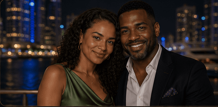 Jada and Michael together against a refined waterfront skyline.
